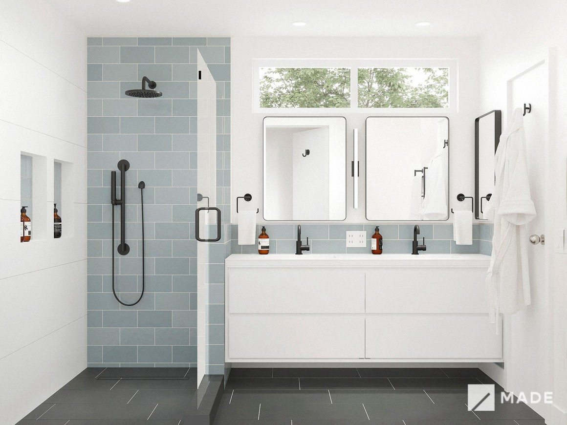 Bathroom design with pale blue tile, glass shower and double vanity