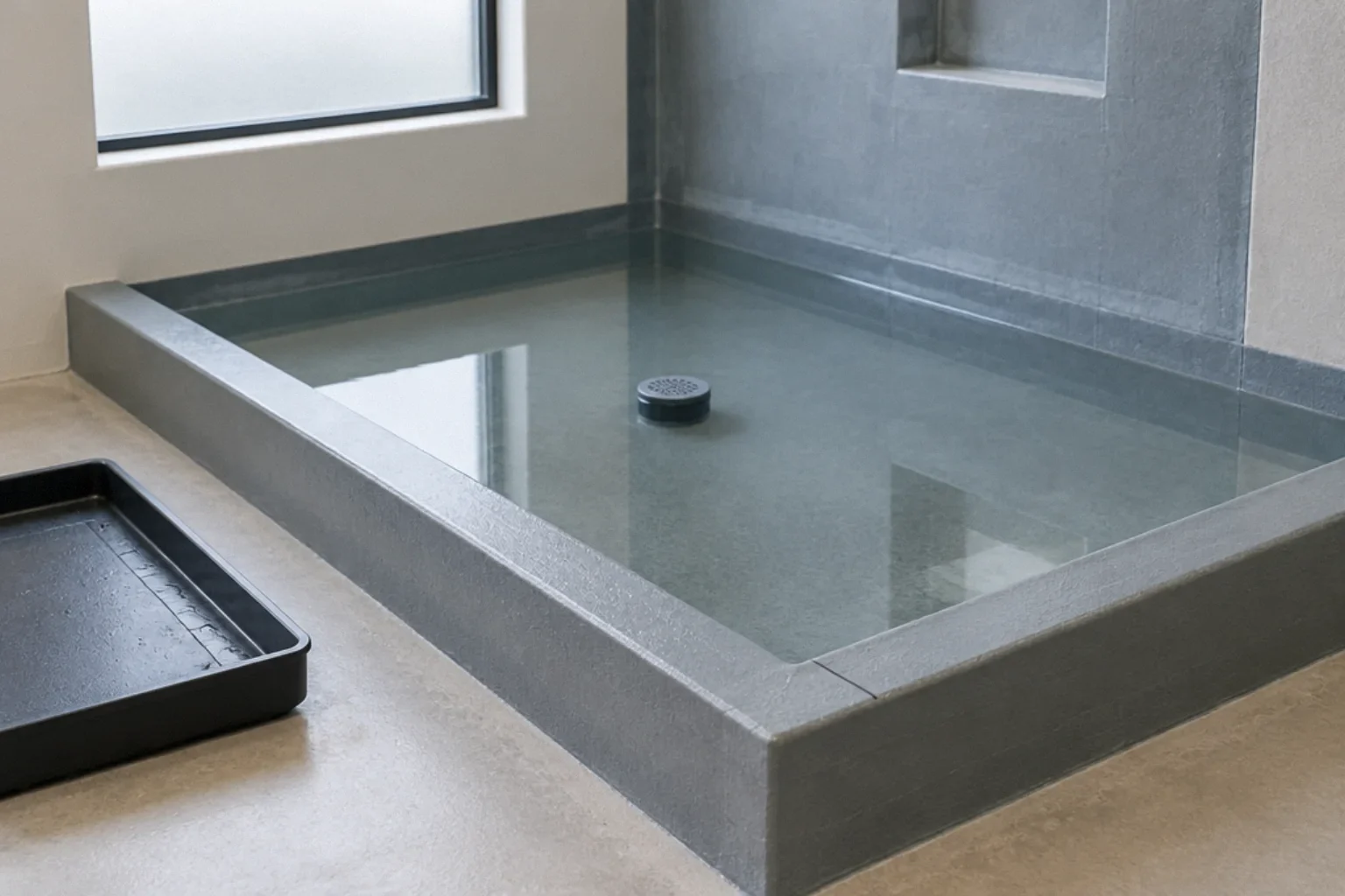Flood test of a shower pan before tile installation.