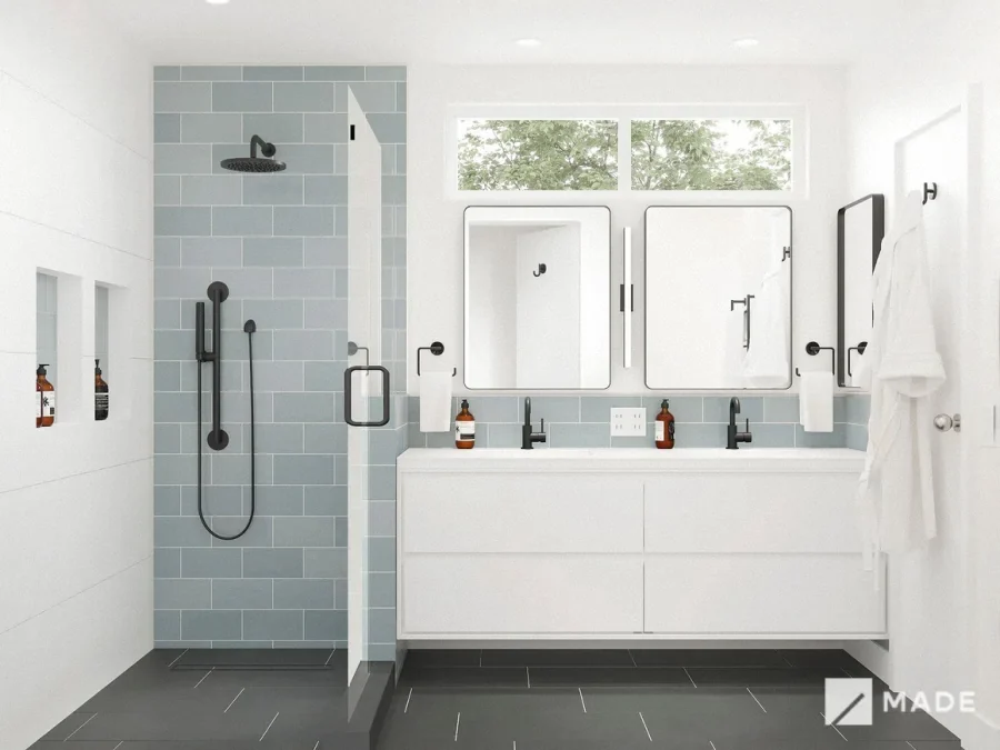 Bathroom design with pale blue tile, glass shower and double vanity